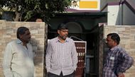 Altaf Khokhar, son of Mahebubbhai Khokhar who was killed in Friday's mosque attacks in New Zealand, speaks with his neighbours outside his home in Sunrendranagar in the western state of Gujarat, India, March 17, 2019. Reuters/Amit Dave