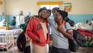 Family members react to a child with broken limbs at Chimanimani Rural district hospital, Manicaland Province, eastern Zimbabwe, on March 18 2019, after the area was hit by the cyclone Idai. AFP/Zinyange Auntony 