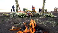 Candle flames burn during a commemoration ceremony for the victims at the scene of the Ethiopian Airlines Flight ET 302 plane crash, near the town Bishoftu, near Addis Ababa, Ethiopia March 14, 2019. Reuters/Tiksa Negeri 