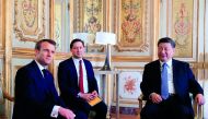 French President Emmanuel Macron (L) meets with Chinese President Xi Jinping (R) at the Elysee Palace in Paris, on March 25, 2019. AFP/pool/Gonzalo Fuentes