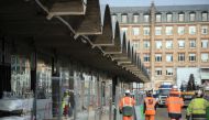 This file photo taken on October 18, 2016 shows workers walking through the construction site of the world-biggest start-up incubator Station F, formerly known as the Halle Freyssinet in Paris. AFP/Lionel Bonav