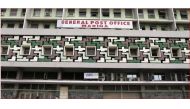 People walk past the general post office in the central business district in Lagos January in this 2012 file photo. Reuters/Akintunde Akinleye