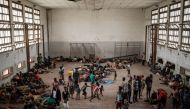 People of Buzi take shelter in the Samora M Machel secondary school used as an evacuation center in Beira Mozambique on March 21, 2019 following the Cyclone Idai. AFP/Yasuyoshi Chiba