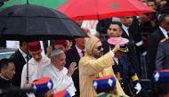 :King Mohammed VI of Morocco (R) welcomes Pope Francis (L) in Rabat upon the pontiff's arrival in the North African country on March 30, 2019 on a visit which will see him meet Muslim leaders and migrants ahead of a mass with the minority Catholic communi