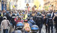 Anti-riot policemen walk behind 