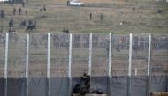 Israeli soldiers clash with Palestinian protestors over the border fence between Israel and the Gaza Strip, as it is seen from its Israeli side March 30, 2019 REUTERS/ Amir Cohen