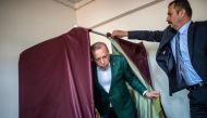 Turkish President Tayyip Erdogan (C) exits a polling booth prior to cast his ballot at a polling station during the municipal elections in Istanbul, on March 31, 2019.  AFP / BULENT KILIC