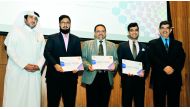 Hussain Al Hijji (left), Vice-President, Qatar Shell Research and Technology Centre; and Dr Abdul Sattar Al Taie (right), Executive Director, Qatar National Research Fund (QNRF), with winners of 11th Annual Undergraduate Research Experience Program Compet