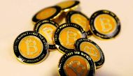 Bitcoin.com buttons are seen displayed on the floor of the Consensus 2018 blockchain technology conference in New York City, May 16, 2018. Reuters/Mike Segar 