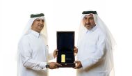 Doha Bank officials unveiling the prize.