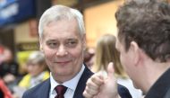 Chairman of the Finnish Social Democratic Party Antti Rinne (L) meets people during a campaign visit on the eve of the Finnish parliamentary elections on April 13, 2019, in Espoo, Finland. Finland OUT / AFP / Lehtikuva / Heikki Saukkomaa
