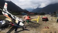 A Summit Air Let L-410 Turbolet aircraft bound for Kathmandu is seen after it hit two helicopters during takeoff at Lukla airport, the main gateway to the Everest region. AFP / STR