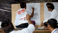 Officials count ballots at a polling centre after the polls closed for the country's general election in Kuta, near Denpasar, on Indonesia's resort island of Bali on April 17, 2019. AFP / SONNY TUMBELAKA