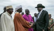 South Sudan‘s President Salva Kiir (R) is greeted by religious leaders on his arrival from Rome, at Juba International Airport in Juba, South Sudan on April 13, 2019. AFP / Akuot Chol
 