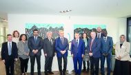H E Sheikh Joaan poses for a group photo with other officials. 