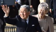 Japan's Emperor Akihito (L) and Empress Michiko (R) wave to well-wishers before leaving Ujiyamada Station after their visiting Ise Jingu shrine in Ise in the central Japanese prefecture of Mie on April 18, 2019, as Emperor Akihito takes part in a series o