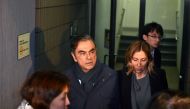 (FILES) In this file photo taken on April 3, 2019, former Nissan Chairman Carlos Ghosn (2nd L) and his wife Carole (2nd R) leave the office of his lawyer in Tokyo. AFP / Kazuhiro Nogi 