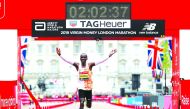 Kenya’s Eliud Kipchoge celebrates as he wins the men’s elite race,  setting a new course record during the London Marathon in London, Britain, yesterday.