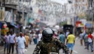 A member of the Sri Lankan security forces sits on a motorbike as he keeps watch outside St Anthony's Shrine, days after a string of suicide bomb attacks across the island on Easter Sunday, in Colombo, Sri Lanka April 28, 2019. REUTERS/Thomas Peter
