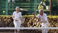 
In this file photo taken on August 27, 2013 Japanese Emperor Akihito (R) and Empress Michiko play tennis at Japan's mountain resort Karuizawa in Nagano prefecture. AFP / Jiji Press