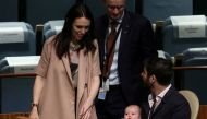 File photo of New Zealand Prime Minister Jacinda Ardern walks back to her baby Neve and partner Clarke Gayford, after speaking at the Nelson Mandela Peace Summit during the 73rd United Nations General Assembly in New York City, New York, U.S., September 2