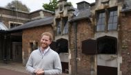 Britain's Prince Harry smiles as he speaks to the media after Meghan, Duchess of Sussex, gave birth to a baby boy, at Windsor Castle, Berkshire county, Britain May 6, 2019. Steve Parsons/Pool via REUTERS