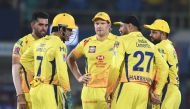 Chennai Super Kings cricketer Harbhajan Singh (2R) celebrates with teammate captain Mahendra Singh Dhoni (L) for the wicket of Delhi Capitals batsman Sherfane Rutherford (unseen) during the 2019 Indian Premier League (IPL) second qualifier Twenty20 cricke