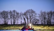 In this file photo taken on March 21, 2019, French farmer Fabien Denis sprays glyphosate herbicide made by the Monsanto agrochemical giant, roundup, to prepare a cornfield to be sowed in Saint-Leonard-des-Bois, northwestern France. AFP / Jean-Francois Mon