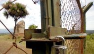 Locked gate of the former entrance to Villa Baviera - formerly known as Colonia Dignidad (Dignity Colony), some 350 km south of Santiago on November 22, 2004.  AFP / Luis Hidalgo 