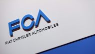 FILE PHOTO: A FCA (Fiat Chrysler Automobiles) logo is displayed on March 6, 2019 during a press day ahead of the Geneva International Motor Show in Geneva.  AFP / Harold CUNNINGHAM
