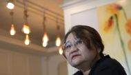 This picture taken on April 30, 2019 shows South Korean scholar and filmmaker Kim So-young speaking during an interview with AFP on her documentary titled 