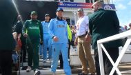 Pakistan's captain Sarfaraz Ahmed (L) and England's captain Eoin Morgan (C) lead their teams out ahead of the 2019 Cricket World Cup group stage match between England and Pakistan at Trent Bridge in Nottingham, central England, on June 3, 2019. AFP / Lind