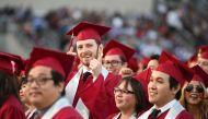 Students earning degrees at Pasadena City College participate in the graduation ceremony, June 14, 2019, in Pasadena, California.  AFP / Robyn Beck 