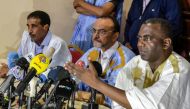 Mohamed Ould Boubacar (C), Biram Ould Dah Ould Abeid (R) and Mohamed Ould Mouloud (L) attend a press conference in Nouakchoot on June 23, 2019, a day after the country's presidential election first round. AFP / SIA KAMBOU
