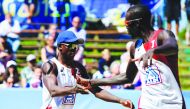 Qatar’s Ahmed Tijan (left) and Cherif Samba celebrate after scoring a point during their third and final Pool D match yesterday.