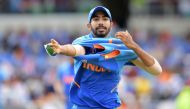 India's Jasprit Bumrah puts on his jumper after bowling during the 2019 Cricket World Cup group stage match between Sri Lanka and India at Headingley in Leeds, northern England, on July 6, 2019. AFP / Dibyangshu Sarkar