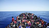 A file photo showing an overcrowded boat with migrants from different African countries is pictured off the Libyan coast in the Mediterranean Sea.
