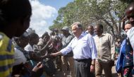 Antonio Guterres, the United Nations Secretary General, greets people at the Mandruzi Resettlement area on July 12, 2019 in Dondo District, as part of Guterres' visit to assess recovery efforts from two cyclones earlier this year in Mozambique. AFP / Wiku