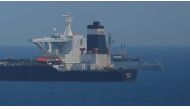 FILE PHOTO: A British Royal Navy patrol vessel guards the oil supertanker Grace 1, that's on suspicion of carrying Iranian crude oil to Syria, as it sits anchored in waters of the British overseas territory of Gibraltar, historically claimed by Spain, Jul