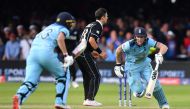 England's Ben Stokes (R) and England's Jos Buttler (L) add runs in the 'super over' during the 2019 Cricket World Cup final between England and New Zealand at Lord's Cricket Ground in London on July 14, 2019. AFP / Paul Ellis