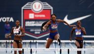 Dalilah Muhammad clears the last hurdle on her way toward winning the Women's 400 Meter Hurdles and setting a new World Record of 52.20 during the 2019 USATF Outdoor Championships at Drake Stadium on July 27, 2019 in Des Moines, Iowa. (Jamie Squire/Getty