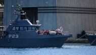 A patrol boat carrying migrants rescued by the Alan Kurdi vessel enters the Maltese harbour, Malta August 4, 2019. REUTERS/Mark Zammit Cordina