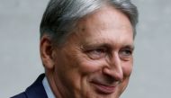 FILE PHOTO: Britain's Chancellor of the Exchequer Philip Hammond leaves the BBC studios in London, Britain, July 21, 2019. REUTERS/Henry Nicholls/File Photo