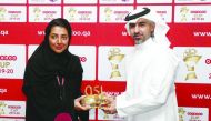 Moza Khalid Al Muhannadi (left), Director of Sponsorship, CSR & Media Strategy at Ooredoo, with Hassan Rabiah Al Kuwari, Executive Director of Marketing, Sales and Communication at Qatar Stars League (QSL) during the sponsorship signing in Doha, yesterday