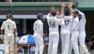 Sri Lanka's Cricketers (R) celebrate after the dismissal of New Zealand's Cricketer Jeet Raval (L) during the third day of the final Cricket Test match between Sri Lanka and New Zealand at P. Sara Oval stadium in Colombo on August 24, 2019. AFP / LAKRUWAN