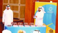 An official picks Tunisia during the official draw ceremony for ANOC World Beach Games’ men’s handball event at the Qatar Olympic Committee headquarters, yesterday. Pictures: Mohamed Farag