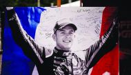 This picture taken on September 1, 2019 shows the portrait of BWT Arden's French driver Anthoine Hubert covered with condolence messages at the entrance of the Spa-Francorchamps circuit in Spa, Belgium. AFP / Kenzo Tribouillard
