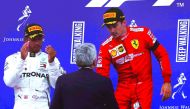 Charles Leclerc (R) of Ferrari celebrates after winning the 2019 F1 Belgium Grand Prix at the Spa-Francorchamps circuit in Spa, Belgium on September 01, 2019. Hamilton (L) of Mercedes took second place as Valtteri Bottas (not seen) of Mercedes have finish