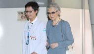 Japan's former empress Michiko (R) enters Tokyo University hospital on September 7, 2019. Japan OUT / AFP / JIJI PRESS / JIJI PRESS / JAPAN POOL VIA JIJI PRESS