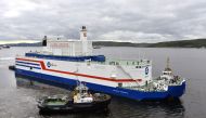 (FILES) This file handout picture taken and released on August 23, 2019, by the Russian nuclear agency ROSATOM shows the floating power unit (FPU) Akademik Lomonosov being towed from the Arctic port of Murmansk, northwestern Russia. AFP PHOTO / ROSATOM